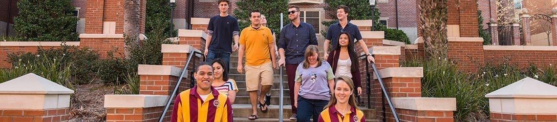 Photo of orientation leaders touring with students through campus