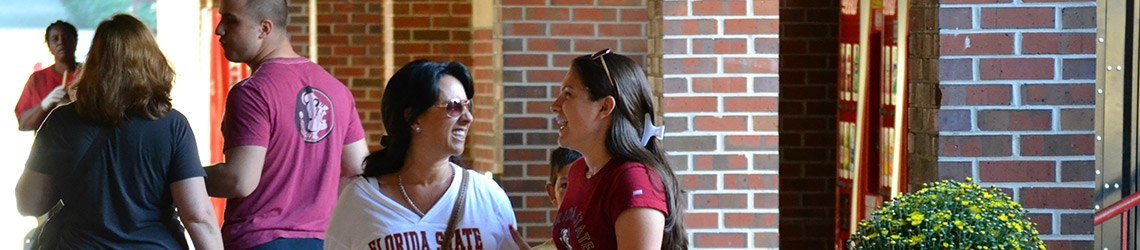 Photo of a family on the campus of Florida State University during Parents' Weekend