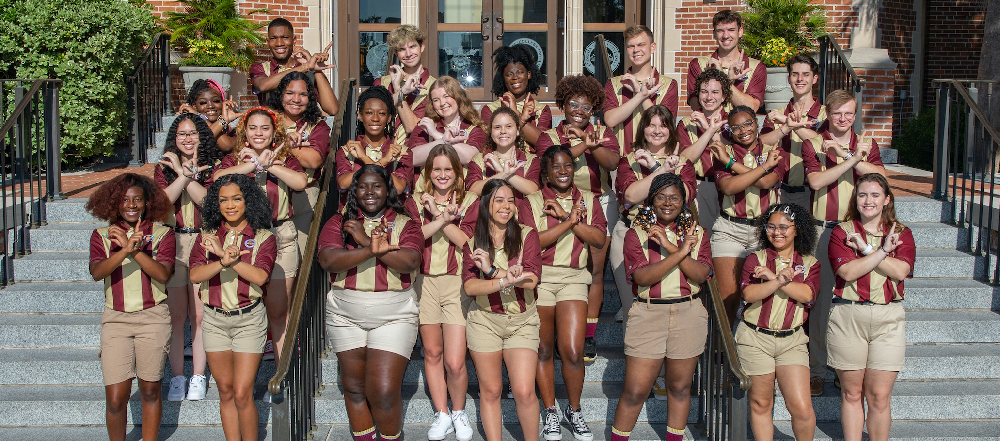 2022 Orientation Leaders with "O" "L" hands