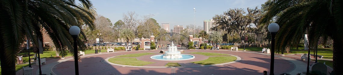 Wide-shot photo of Wescott Fountain and the circular brick pathway around it 